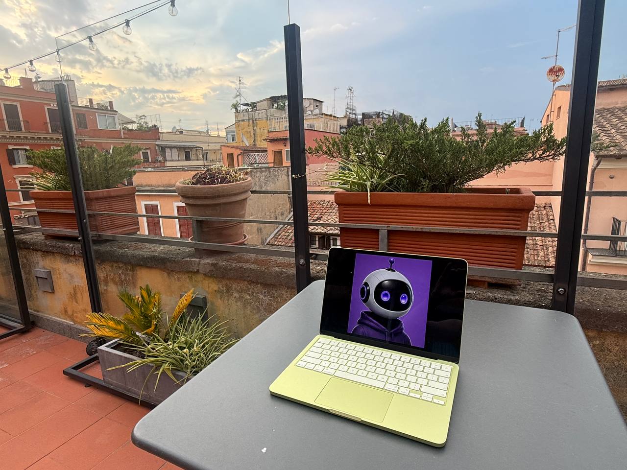 CofounderGPT displayed on a laptop overlooking Roman rooftops.
